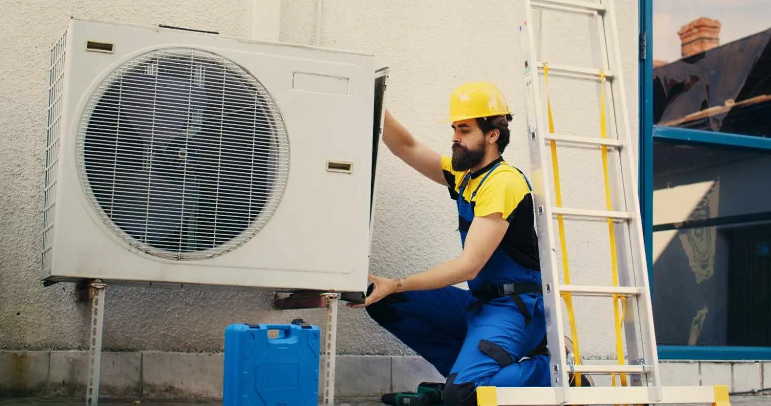 Outdoor air conditioning unit mounted on a house wall